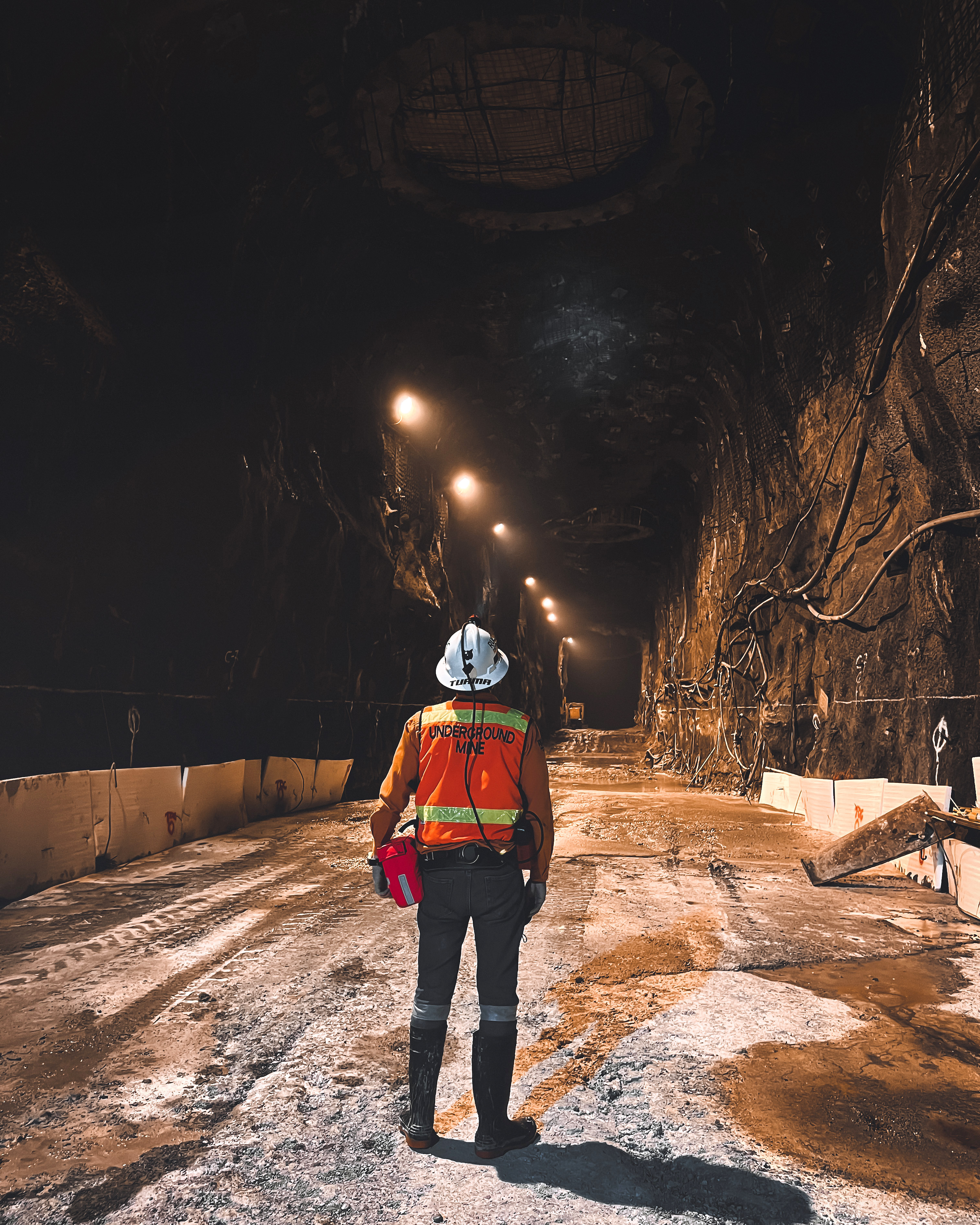 Field activity inside a large underground mine tunnel