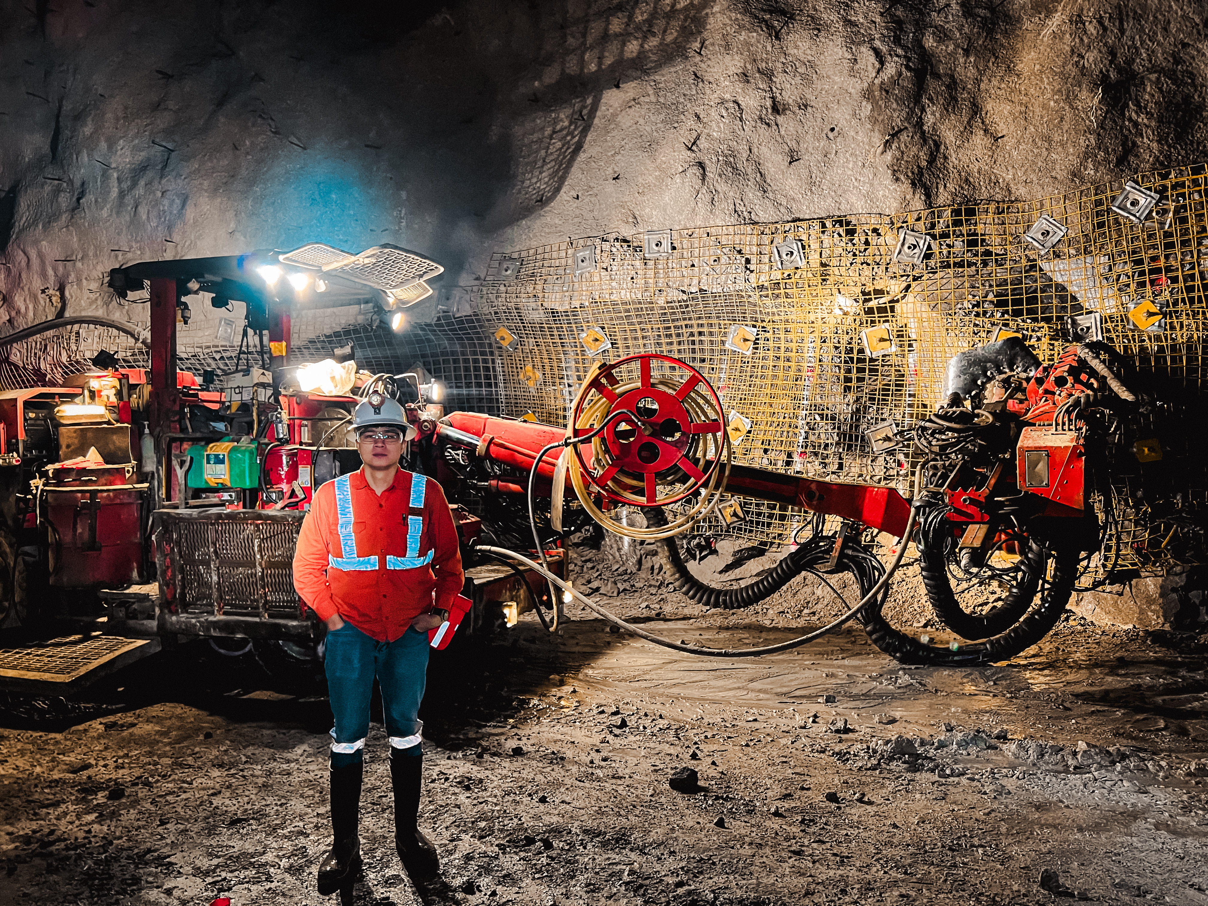 Reymond beside underground mining equipment and ground-support mesh