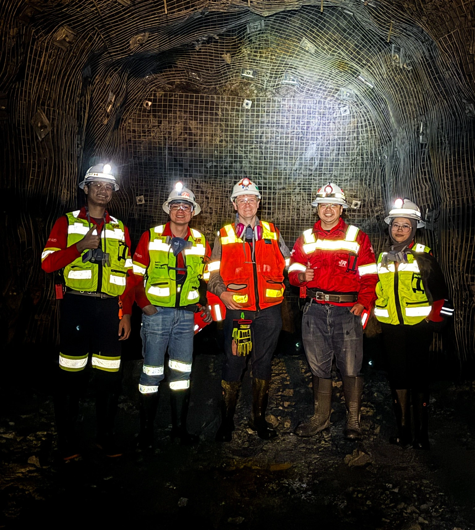 Five project team members during an underground field inspection