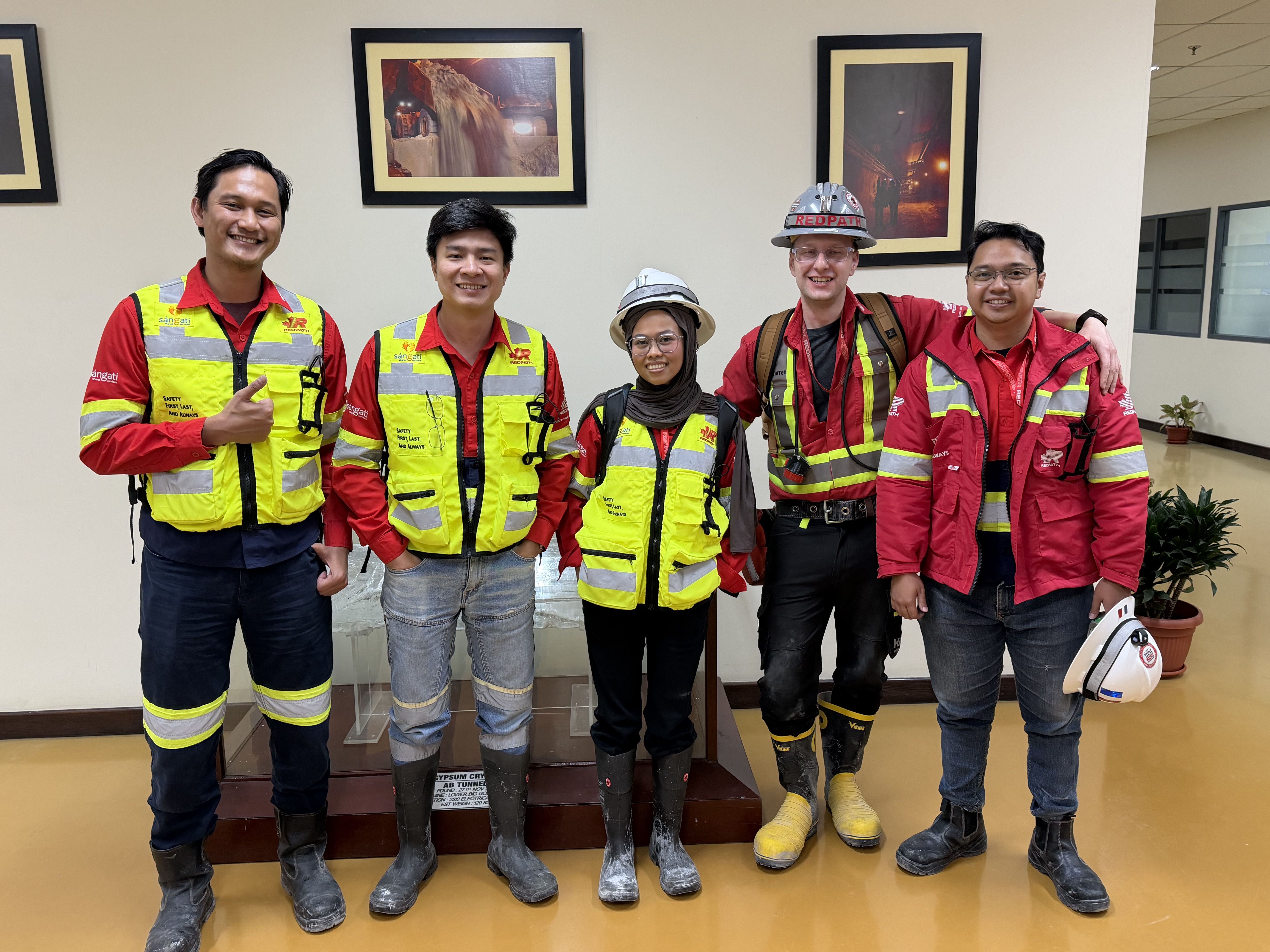 Reymond with four colleagues in high-visibility workwear